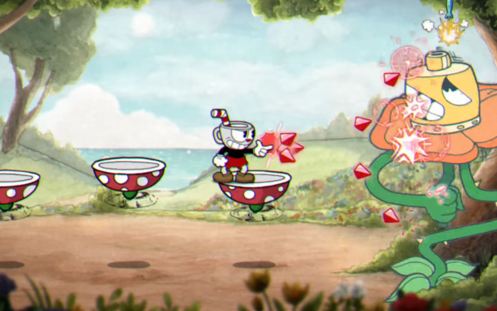 Imagem do game Cuphead com o personagem principal Cuphead atirando em um chefe de fase.